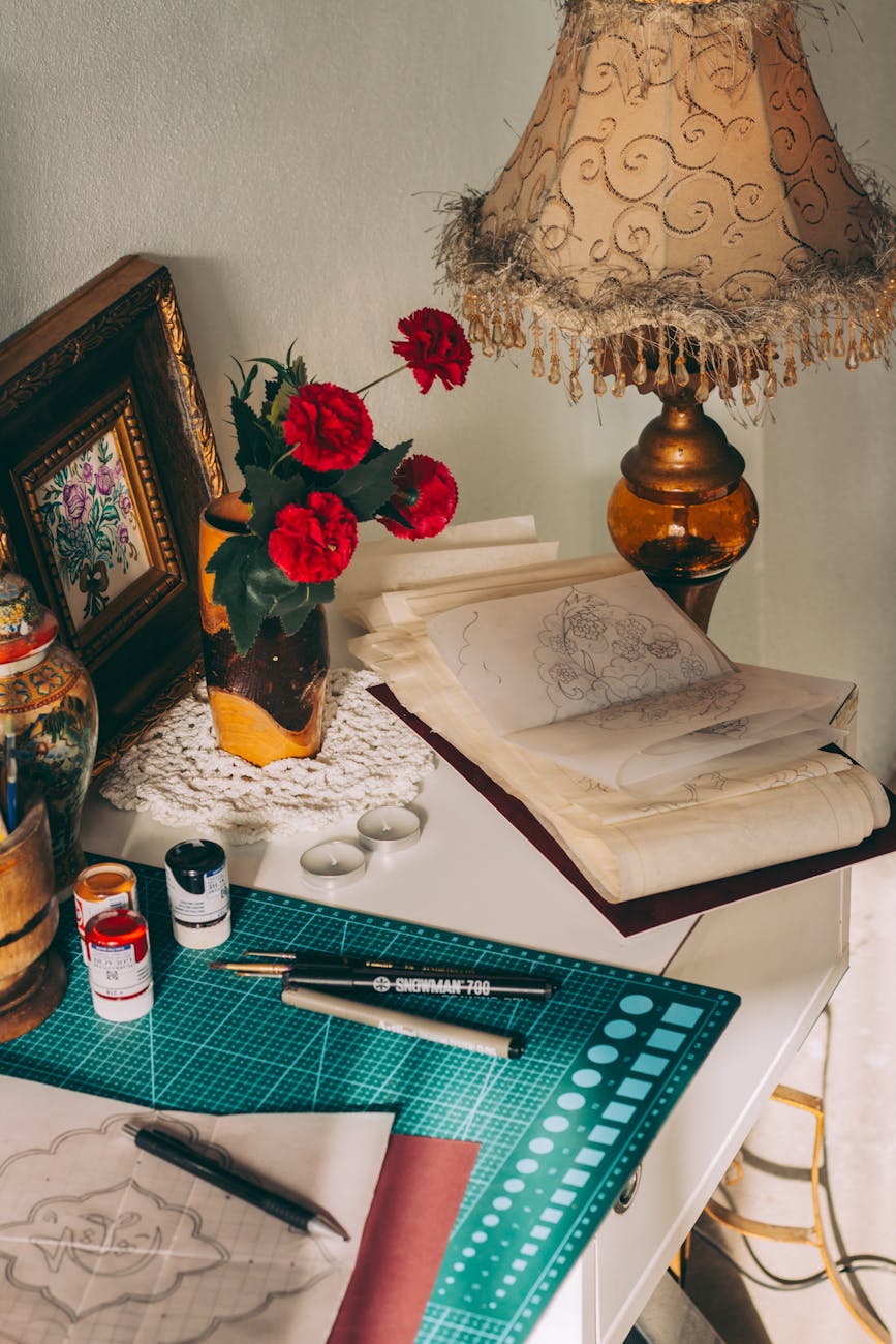 vintage artistic workspace with roses and sketches