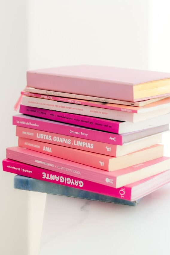 stack of books on white table
