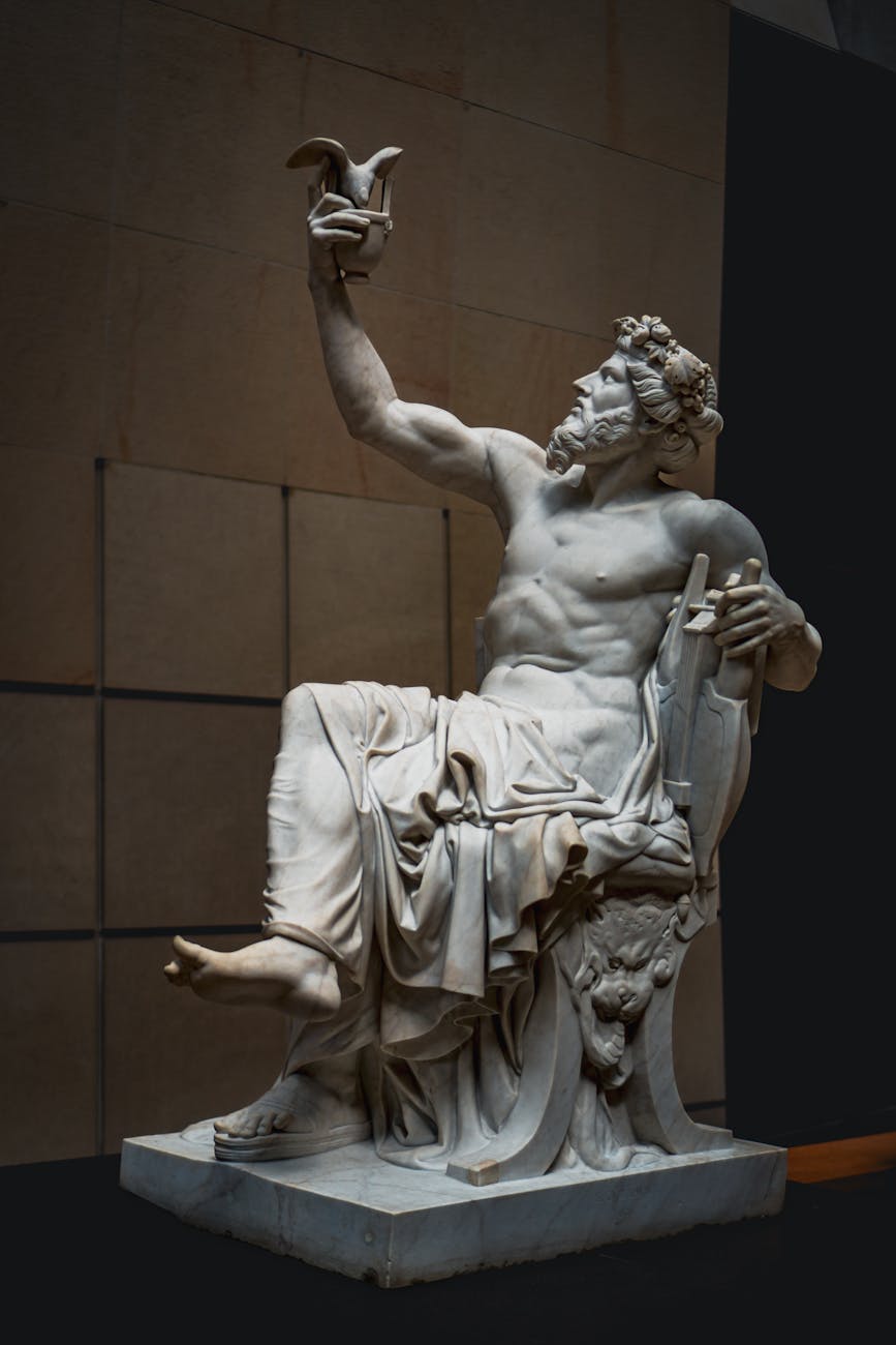 a statue of a man holding a bird